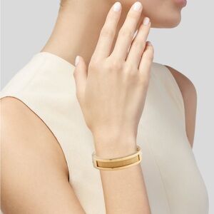 Ralph Lauren Collection thick hinged goldtone bangle bracelet